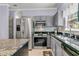 Beautifully updated kitchen with stainless steel appliances, gray cabinets, and granite countertops at 3257 Heathland Way, Mount Pleasant, SC 29466