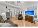 Spacious living room with hardwood floors, comfortable seating, and seamless access to staircase and kitchen at 3257 Heathland Way, Mount Pleasant, SC 29466