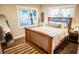 Cozy bedroom featuring a wood bed frame, natural light, and stylish decor at 3480 Johan Blvd, Johns Island, SC 29455