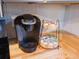 A convenient coffee station featuring a Keurig machine and a coffee pod holder at 3480 Johan Blvd, Johns Island, SC 29455