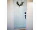 Aesthetic light blue front door enhanced by a lovely wreath and modern digital lock at 3480 Johan Blvd, Johns Island, SC 29455
