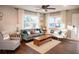 Cozy living room showcasing comfortable seating, wood flooring, and plenty of natural light at 3480 Johan Blvd, Johns Island, SC 29455