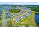 Planned community showcasing well-maintained homes, a lake, and lush landscaping from an aerial perspective at 357 Parish Farms Dr, Summerville, SC 29486