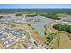 Aerial view showcasing the community with picturesque lake, walking trails, and residential area at 357 Parish Farms Dr, Summerville, SC 29486