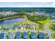 An aerial view shows homes alongside a pond, surrounded by trees and green spaces at 357 Parish Farms Dr, Summerville, SC 29486
