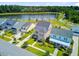 An eye-level aerial shot of several craftsman style homes near a pond at 357 Parish Farms Dr, Summerville, SC 29486