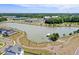 Aerial view of community with a lake, commercial area, and walking trails at 357 Parish Farms Dr, Summerville, SC 29486