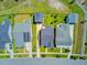 An aerial view showcases a neighborhood's rooftops, lawns, and driveway layouts on a sunny day at 357 Parish Farms Dr, Summerville, SC 29486