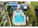 Overhead aerial view of the community pool with a playground, a pool house, covered patio, and chairs at 357 Parish Farms Dr, Summerville, SC 29486