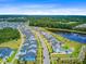Expansive aerial view of a planned community with beautiful homes and a serene lake at 357 Parish Farms Dr, Summerville, SC 29486