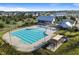 Aerial view of the community pool with a pool house, playground, covered patio, and lounge chairs at 357 Parish Farms Dr, Summerville, SC 29486