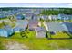 Expansive aerial view of a community showcasing well-maintained homes and green spaces on a sunny day at 357 Parish Farms Dr, Summerville, SC 29486
