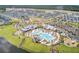 Community aerial showcases modern pool area and water slide; surrounded by Gathering homes and lush green spaces at 357 Parish Farms Dr, Summerville, SC 29486