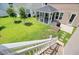 Elevated view of the backyard featuring a patio, screened porch, and lush greenery for serene outdoor living at 357 Parish Farms Dr, Summerville, SC 29486
