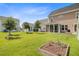 Expansive backyard with mature trees, an enclosed patio, and plenty of space for outdoor activities at 357 Parish Farms Dr, Summerville, SC 29486