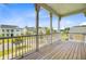 Charming balcony with decorative pillars and rail overlooking lush landscaping and neighborhood at 357 Parish Farms Dr, Summerville, SC 29486