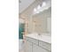 Bathroom features gray vanity with white countertop and shelving unit for storage at 357 Parish Farms Dr, Summerville, SC 29486