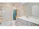 Bathroom with walk-in shower, gray vanity, and shelving unit for storage at 357 Parish Farms Dr, Summerville, SC 29486