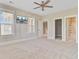 Bright bedroom with ceiling fan, tv, and access to bathroom and walk-in closet at 357 Parish Farms Dr, Summerville, SC 29486