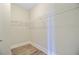 An empty walk-in closet with wire shelving and light wood flooring at 357 Parish Farms Dr, Summerville, SC 29486