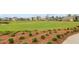 Scenic community green space with walking paths, a pond, and well-maintained landscaping at 357 Parish Farms Dr, Summerville, SC 29486