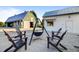 Inviting courtyard featuring Adirondack chairs, a fire pit, and views of the barn-style community buildings at 357 Parish Farms Dr, Summerville, SC 29486