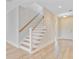 A welcoming foyer features a staircase, light-colored flooring and freshly-painted white walls at 357 Parish Farms Dr, Summerville, SC 29486