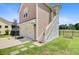 Garage with a basketball hoop offers both parking and recreation, alongside a manicured lawn at 357 Parish Farms Dr, Summerville, SC 29486
