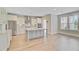 Contemporary kitchen featuring stainless appliances, an island, ample cabinetry, and natural light from the windows at 357 Parish Farms Dr, Summerville, SC 29486