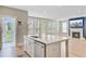 Open floor plan showcasing granite counters and a view into the living room with a fireplace at 357 Parish Farms Dr, Summerville, SC 29486