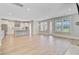 Open-concept living room with hardwood floors, recessed lighting, and large windows for lots of natural light at 357 Parish Farms Dr, Summerville, SC 29486