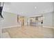 Spacious living room showcasing hardwood floors and transitions into a kitchen with stainless steel appliances at 357 Parish Farms Dr, Summerville, SC 29486