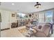 This living room features a sofa, fireplace, TV, and decorative displays on the walls at 357 Parish Farms Dr, Summerville, SC 29486