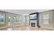 Open-concept living room featuring a fireplace, transom windows, and wood flooring at 357 Parish Farms Dr, Summerville, SC 29486