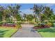 Picturesque park featuring a water fountain, lush trees, flowering shrubs, manicured lawn and benches at 357 Parish Farms Dr, Summerville, SC 29486