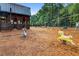 Community playground featuring a barn-themed play structure with swing sets and rocking horse at 357 Parish Farms Dr, Summerville, SC 29486