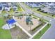 An aerial view of a community playground surrounded by landscaping, green space, homes, and sidewalks at 357 Parish Farms Dr, Summerville, SC 29486
