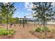 Community playground with swings, slides, and lush landscaping at 357 Parish Farms Dr, Summerville, SC 29486