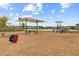 Community playground with a sun shade, slides, and benches at 357 Parish Farms Dr, Summerville, SC 29486