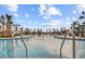 Community pool with palm trees, lounge chairs, and tables with umbrellas at 357 Parish Farms Dr, Summerville, SC 29486