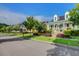 Charming street view showcasing the beautiful homes, manicured lawns, and vibrant landscaping of the community at 357 Parish Farms Dr, Summerville, SC 29486