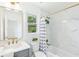 Stylish bathroom with marble countertop, gold accents, and bathtub shower featuring curtain at 43 Heathwood Dr, Charleston, SC 29407