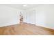 Bright, airy bedroom featuring hardwood floors, closet, and doorway to another room at 43 Heathwood Dr, Charleston, SC 29407