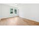 Bright, spacious bedroom with hardwood floors, ceiling fan, and windows offering a pleasant view at 43 Heathwood Dr, Charleston, SC 29407