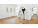 Stylish entryway featuring modern console table, round mirror, and hardwood flooring at 43 Heathwood Dr, Charleston, SC 29407