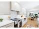 Modern kitchen boasts white cabinetry, quartz countertops, and stainless steel oven at 43 Heathwood Dr, Charleston, SC 29407