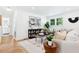 Cozy living room with stylish decor, natural light, comfortable seating, and hardwood floors at 43 Heathwood Dr, Charleston, SC 29407