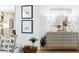 Close up of a living room and open kitchen with stylish decor, artwork, and modern furniture at 43 Heathwood Dr, Charleston, SC 29407
