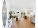 Bright, airy living room with an open layout, modern chandelier, and hardwood flooring at 43 Heathwood Dr, Charleston, SC 29407