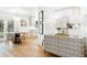 A cozy living room and dining area showcasing modern furniture, artwork, and contemporary lighting fixtures at 43 Heathwood Dr, Charleston, SC 29407